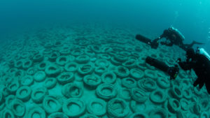 Global Underwater Explorers Divers for Project Baseline are inspecting the Osborne Tire Reef off the coast of Fort Lauderdale Florida